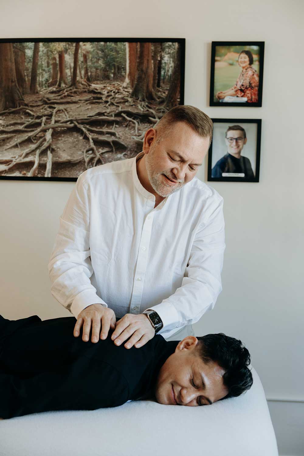 Photo of Brian Brunius giving a Reiki treatment to Amilyo Escobar on the day of his initiation as a Reiki master. 