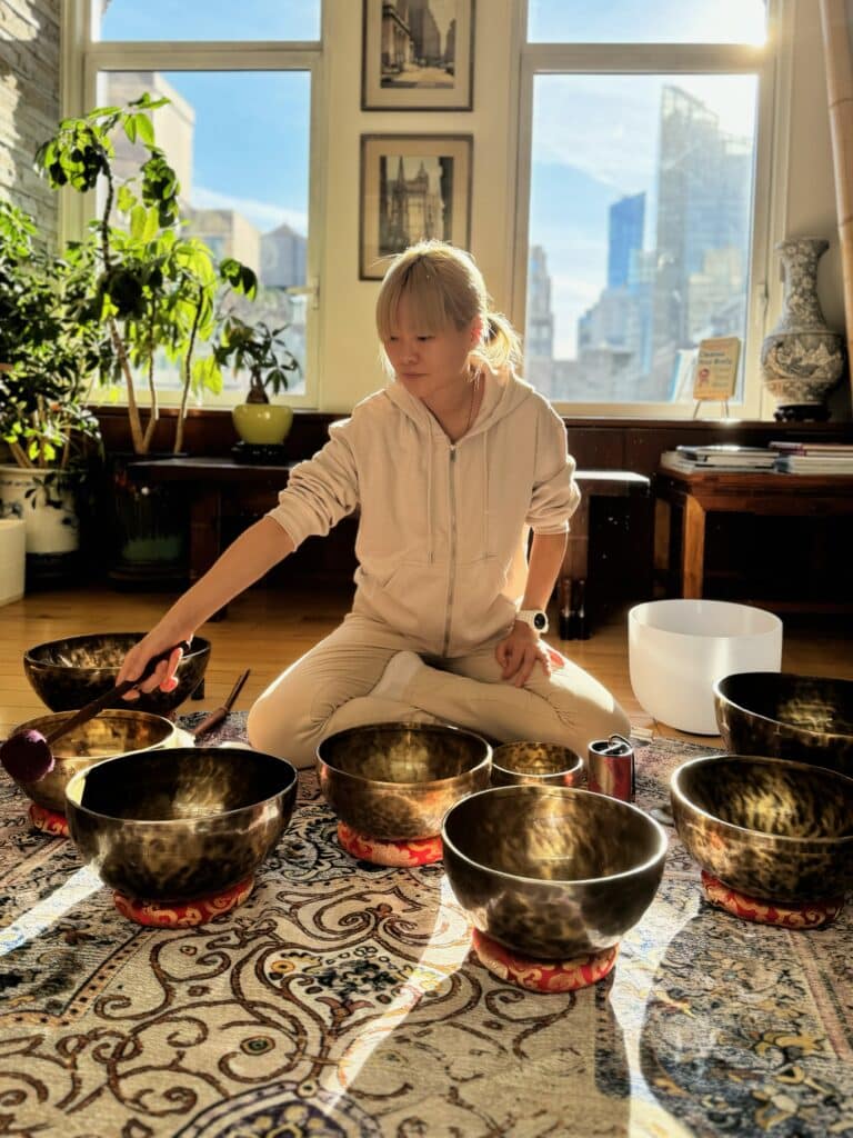 Photo of Vicki Tseng of FFLOY NYC performing a sound bath experience